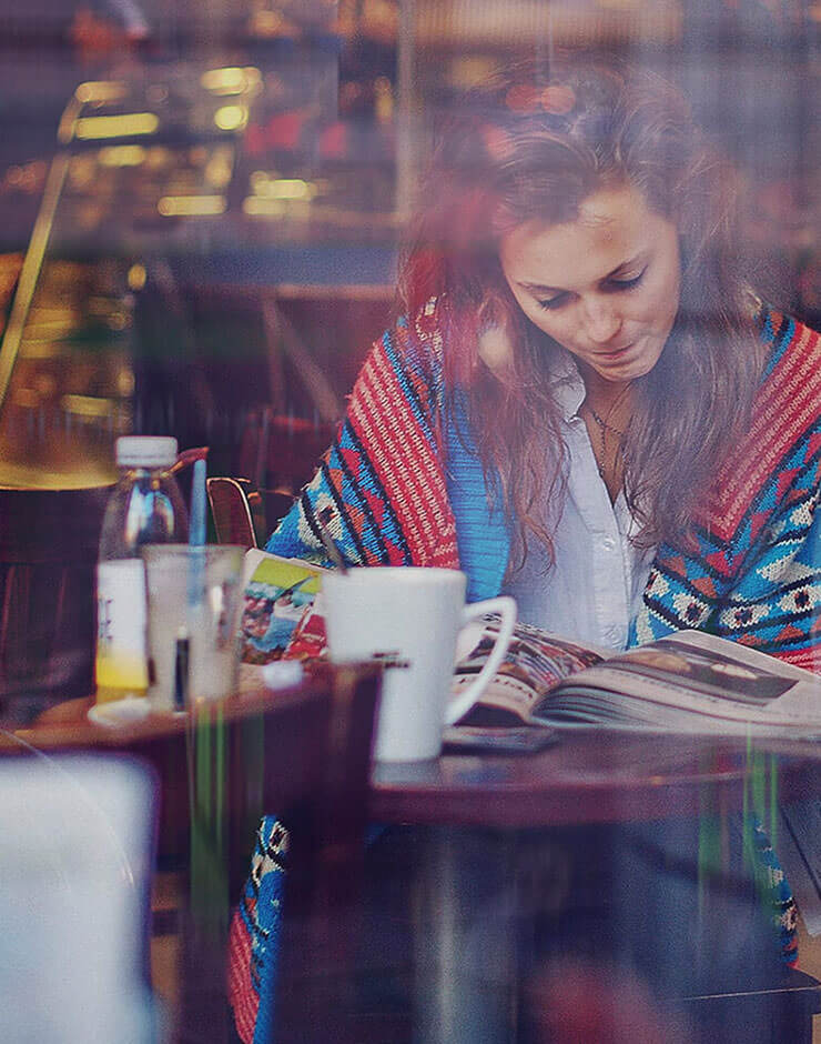 Lady reading a book.