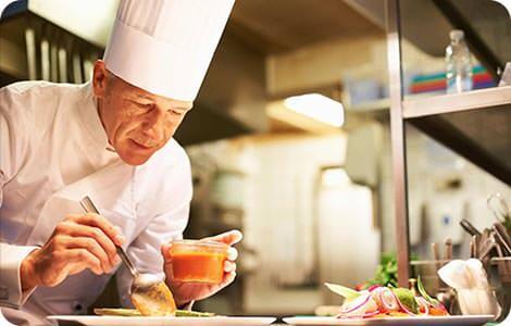 Chef about to taste soup.